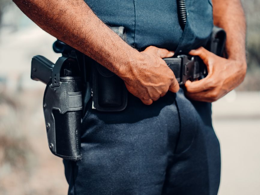 Person practicing drawing a concealed carry handgun from an IWB holster